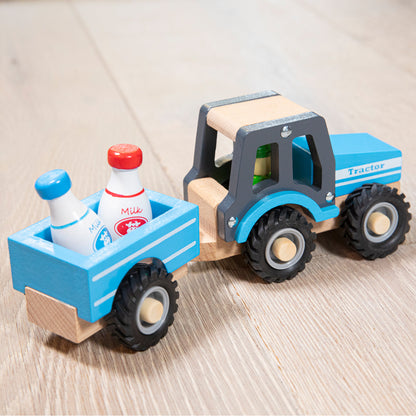 Tractor met aanhanger - melkbussen